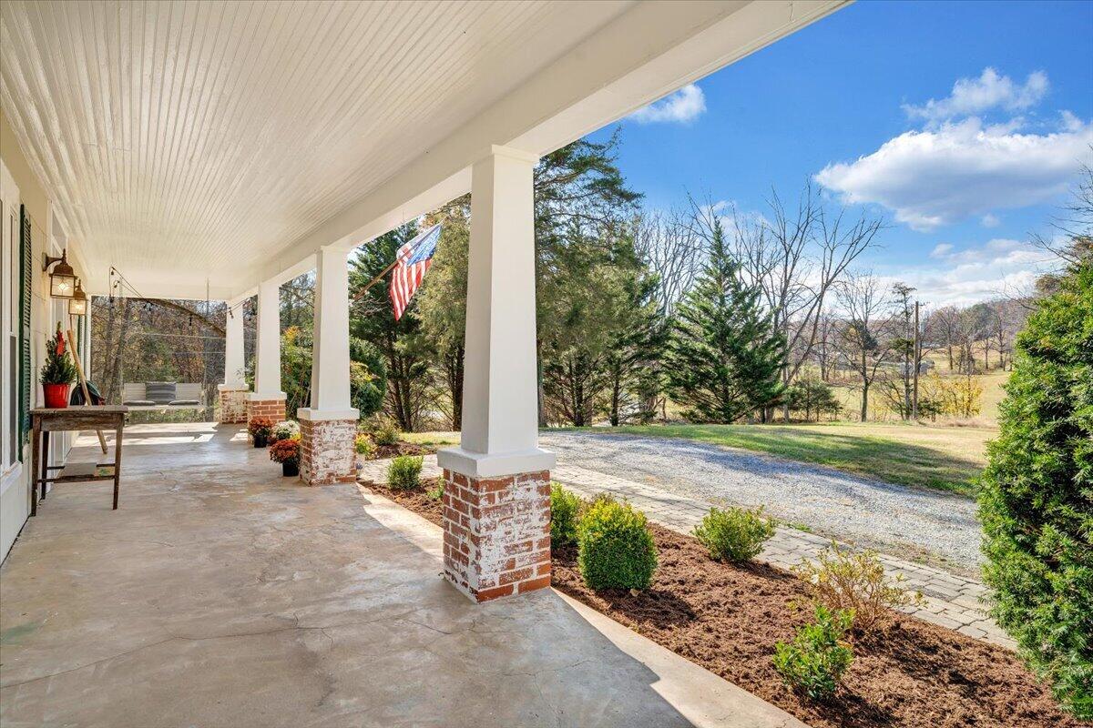 7758 Old Fincastle Road Fincastle, VA 24090 - Photo 9 of 99 a view of a patio with table and chairs and potted plants