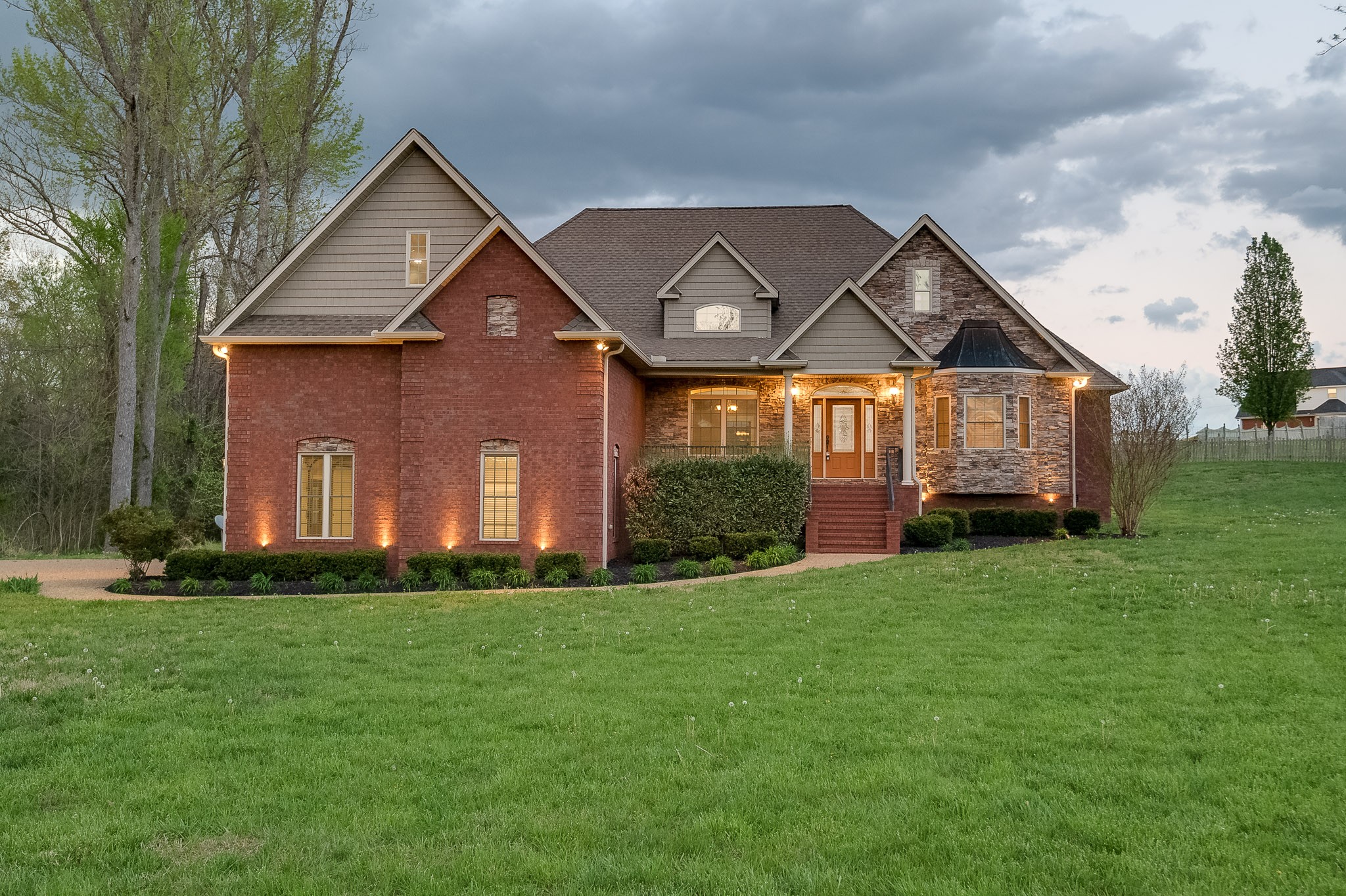 705 Deer Ridge Lane Lebanon, TN 37087 - Photo 1 of 49 a front view of a house with a yard and garage
