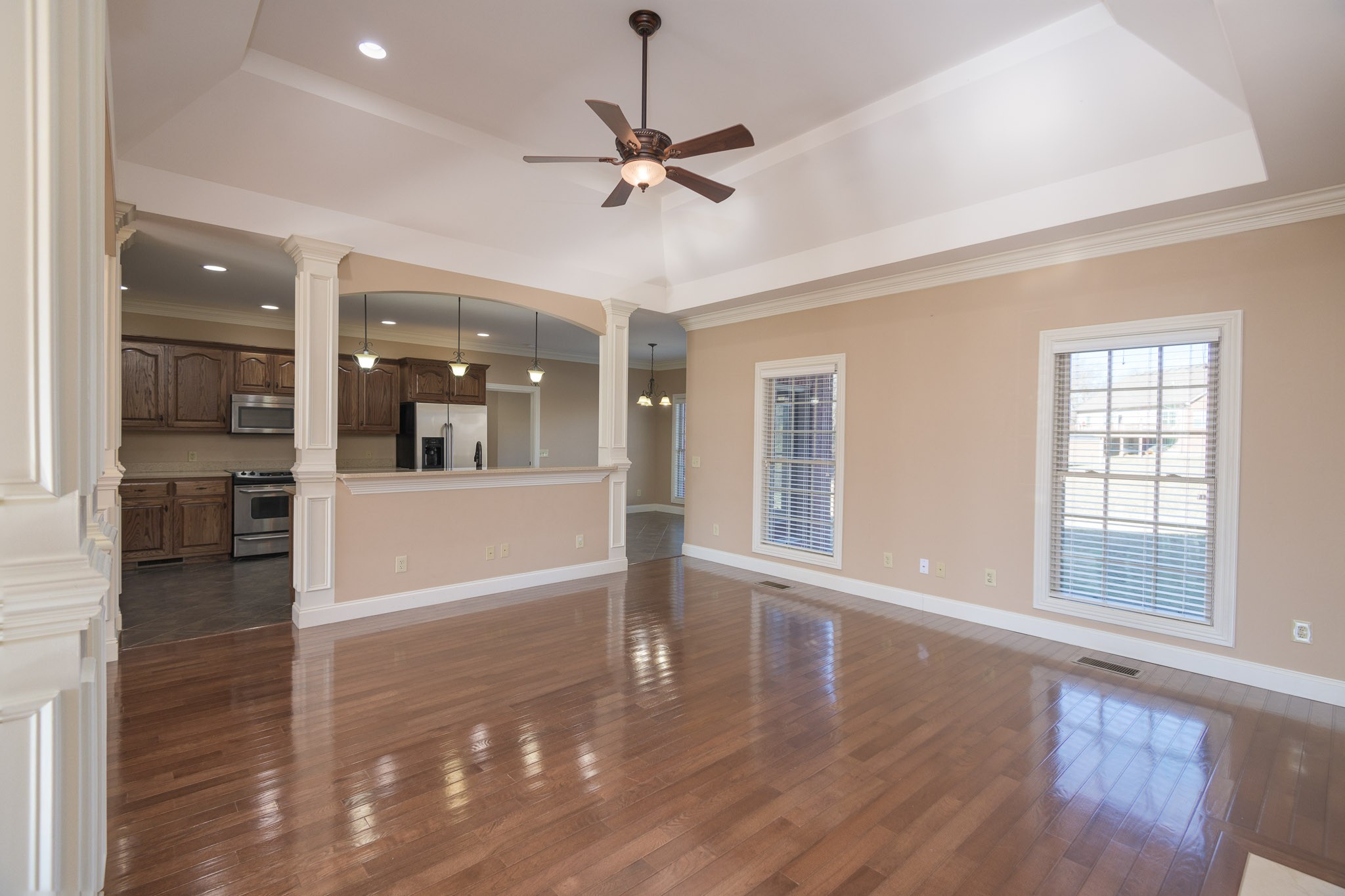 705 Deer Ridge Lane Lebanon, TN 37087 - Photo 12 of 49 a view of a livingroom with a hardwood floor and a ceiling fan