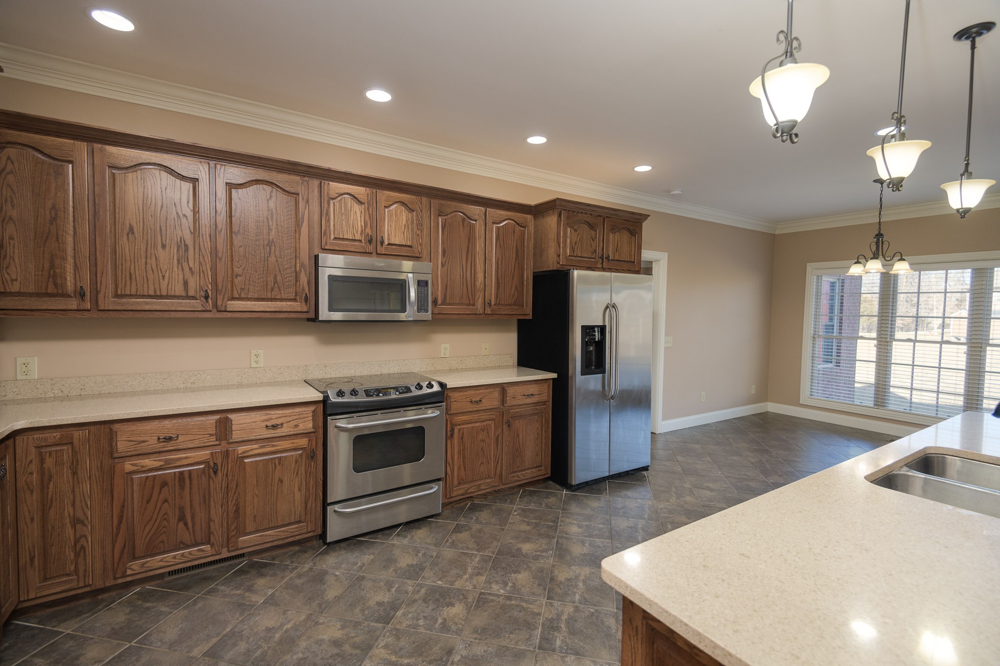 705 Deer Ridge Lane Lebanon, TN 37087 - Photo 14 of 49 a kitchen with a stove a sink and a refrigerator