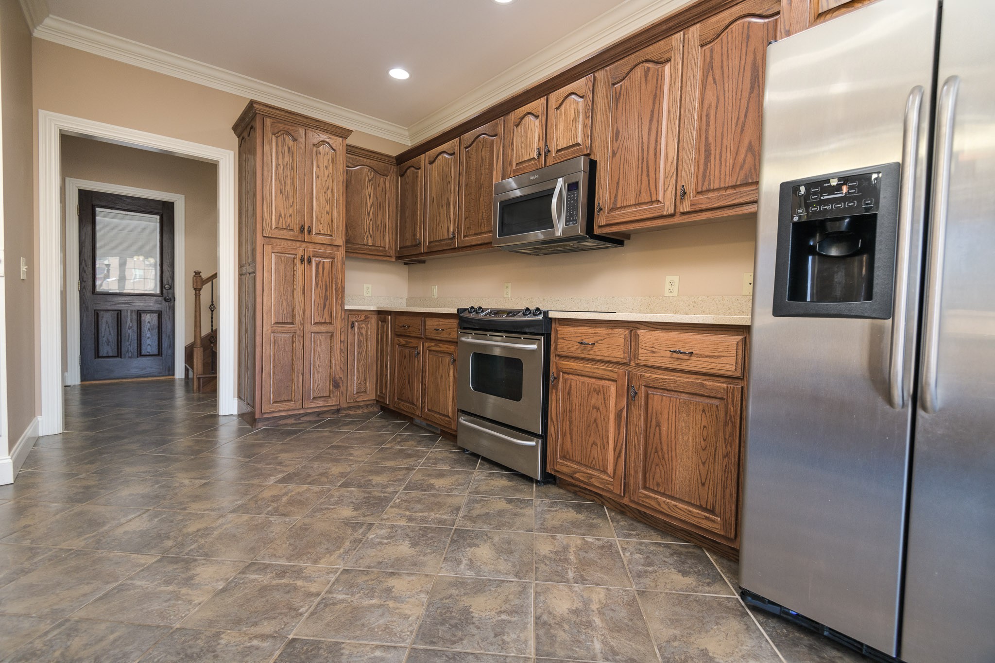 705 Deer Ridge Lane Lebanon, TN 37087 - Photo 15 of 49 a kitchen with stainless steel appliances granite countertop a refrigerator a stove and a sink