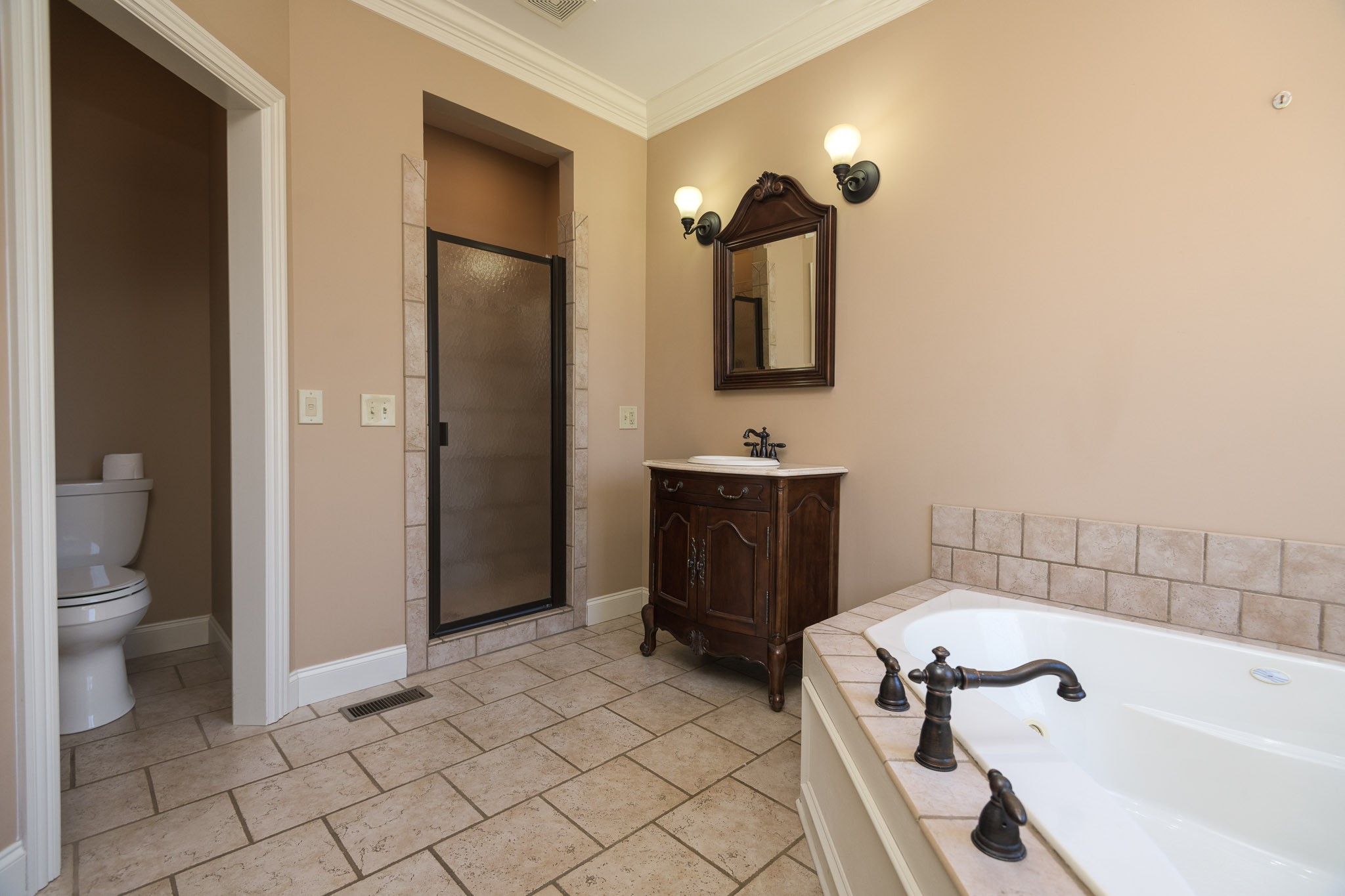 705 Deer Ridge Lane Lebanon, TN 37087 - Photo 23 of 49 a bathroom with a sink a toilet and shower