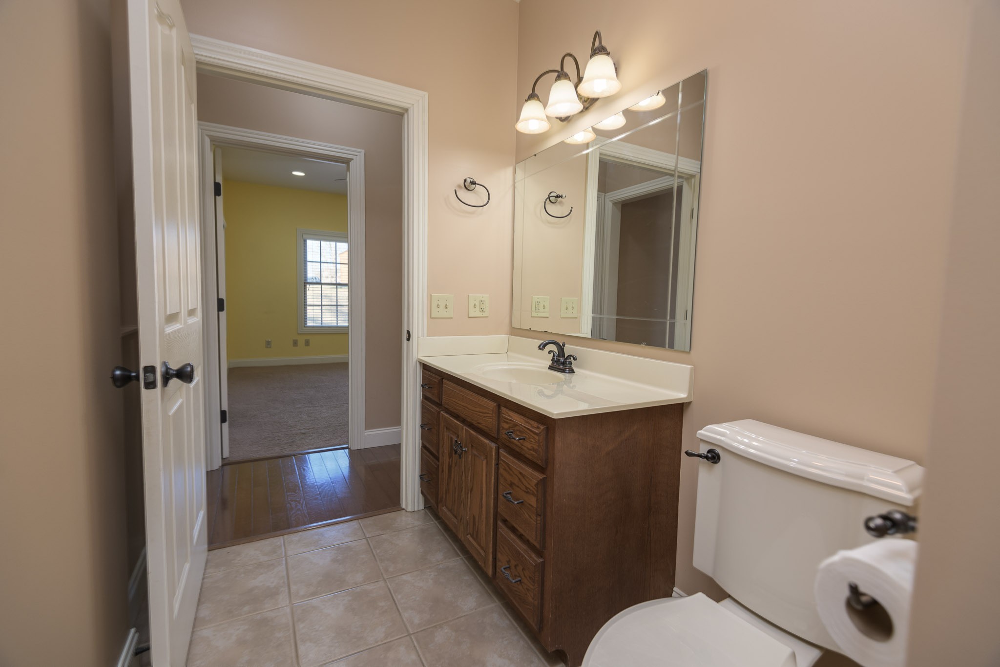 705 Deer Ridge Lane Lebanon, TN 37087 - Photo 26 of 49 a bathroom with a sink vanity mirror and toilet