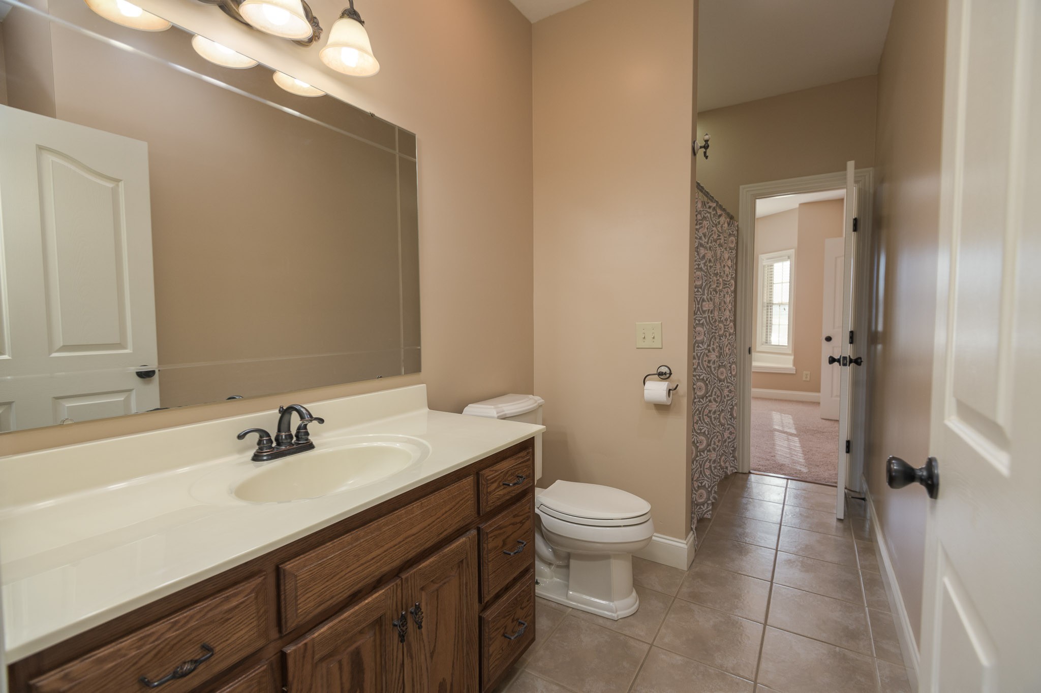 705 Deer Ridge Lane Lebanon, TN 37087 - Photo 27 of 49 a bathroom with a sink a toilet and shower