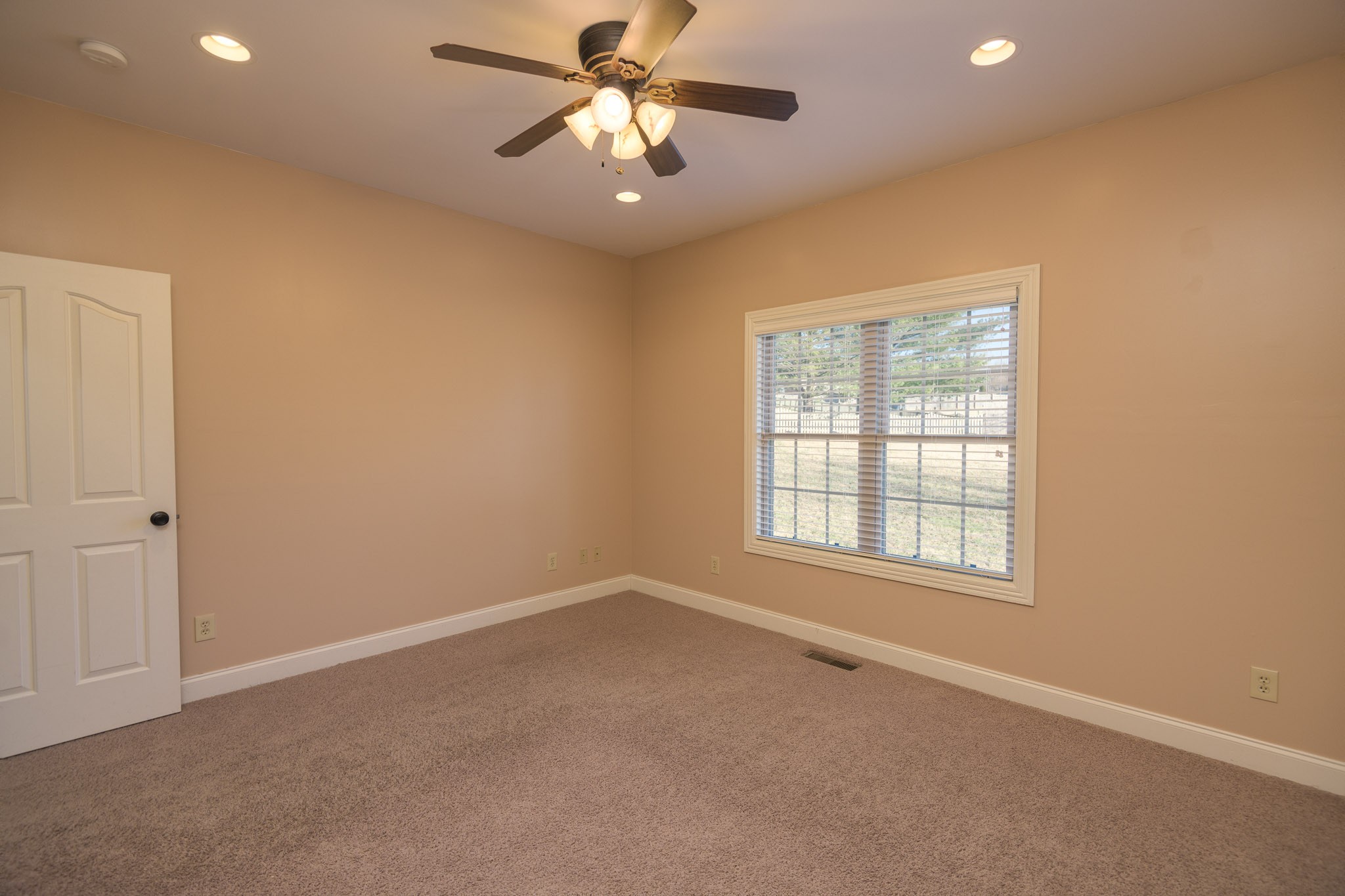 705 Deer Ridge Lane Lebanon, TN 37087 - Photo 31 of 49 an empty room with windows and fan