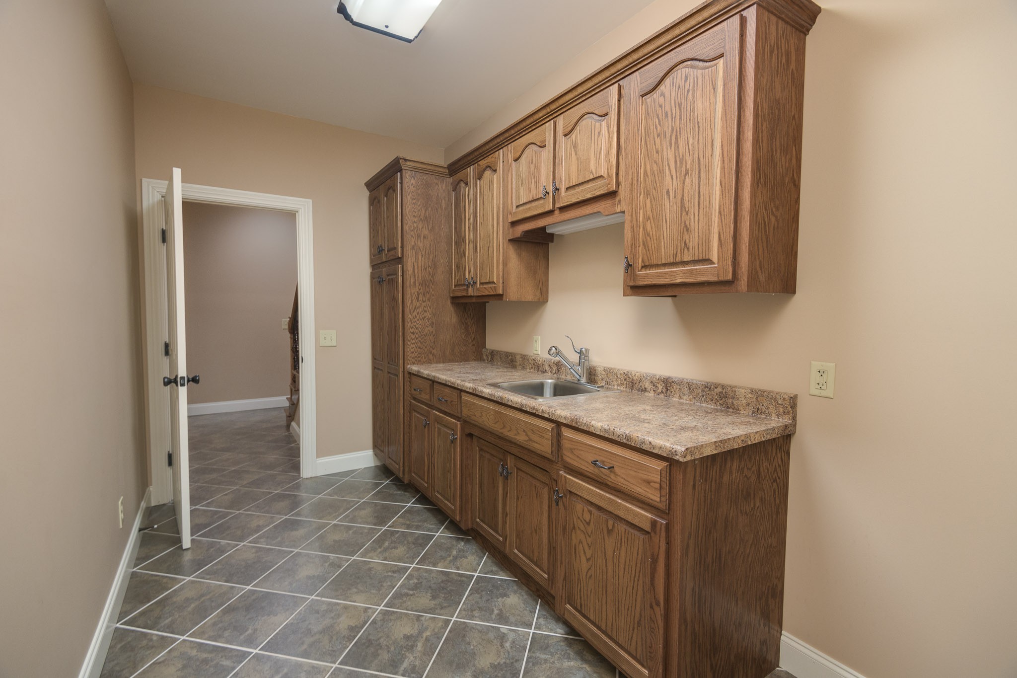 705 Deer Ridge Lane Lebanon, TN 37087 - Photo 35 of 49 a kitchen with stainless steel appliances granite countertop a sink stove and cabinets