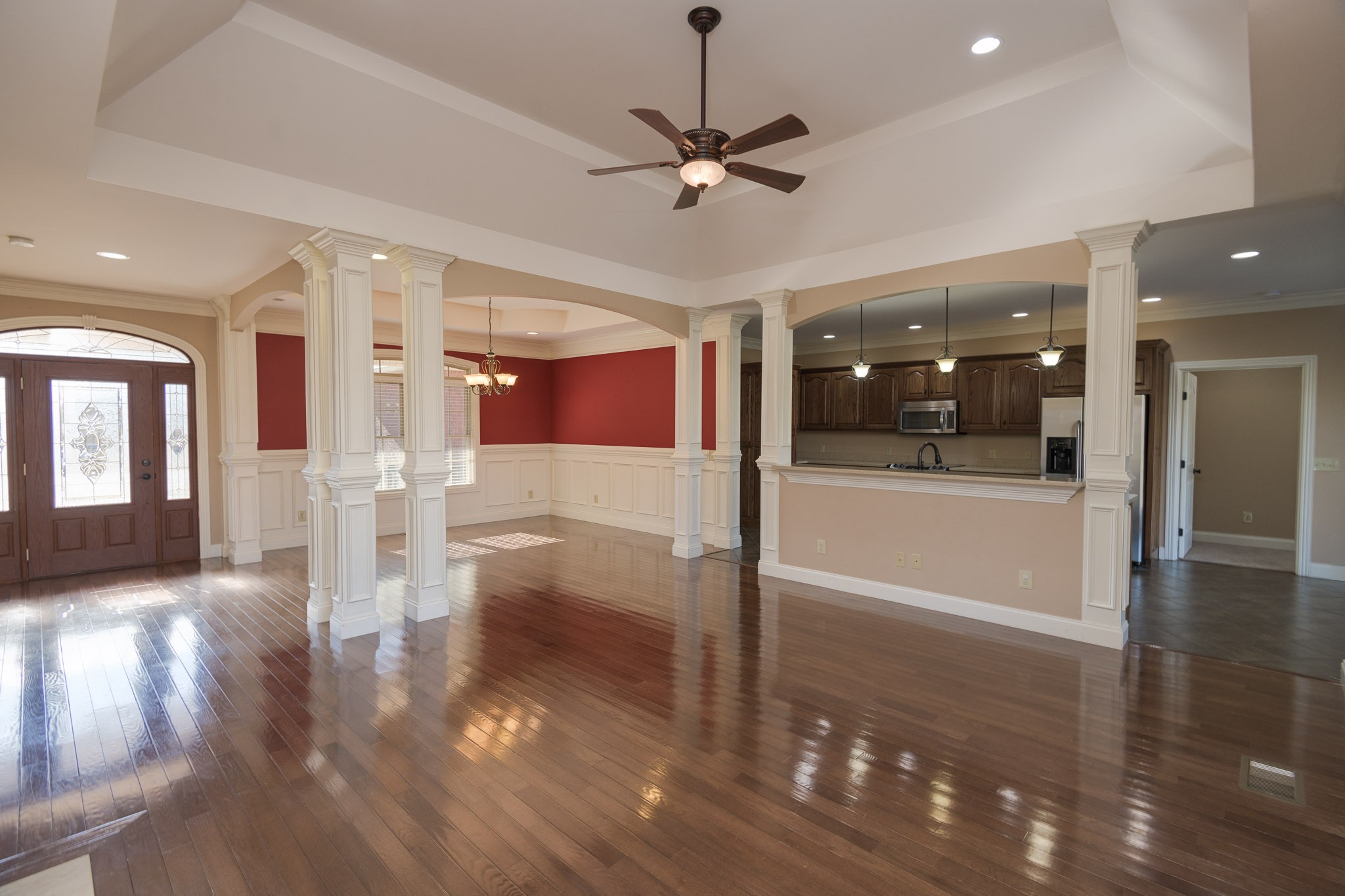705 Deer Ridge Lane Lebanon, TN 37087 - Photo 5 of 49 a view of a hallway with wooden floor and a kitchen