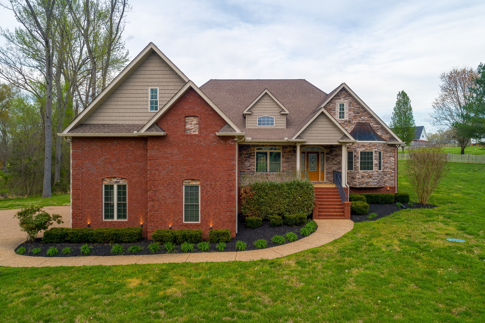 705 Deer Ridge Lane Lebanon, TN 37087 - Photo 43 of 49 a front view of a house with a yard and garage
