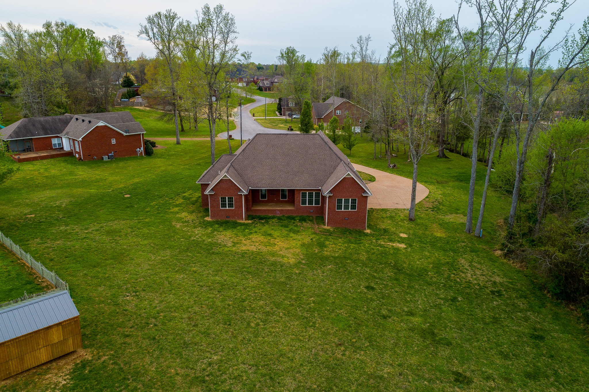 705 Deer Ridge Lane Lebanon, TN 37087 - Photo 45 of 49 an aerial view of a house with backyard and pool