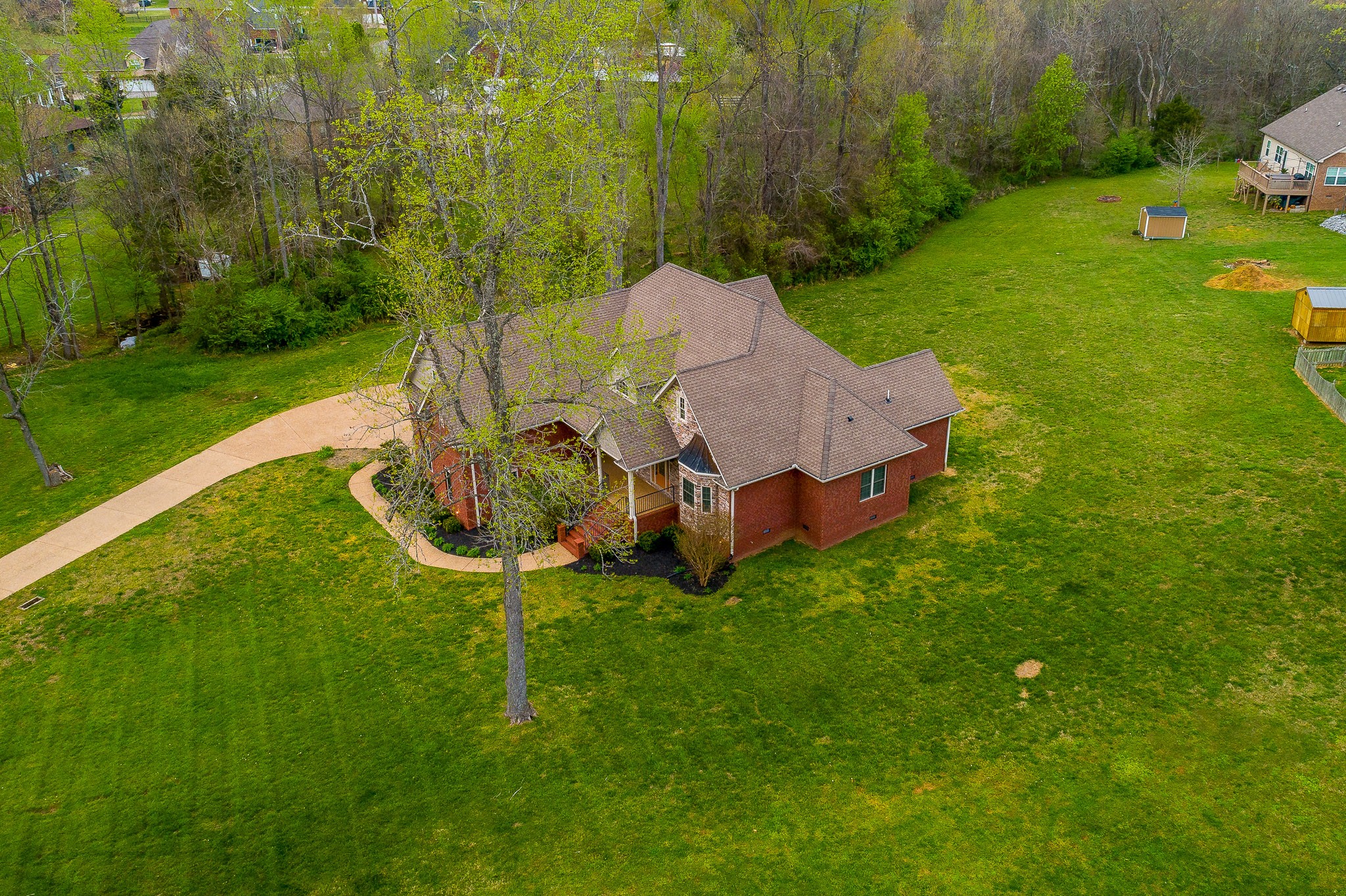 705 Deer Ridge Lane Lebanon, TN 37087 - Photo 48 of 49 a backyard of a house with table and chairs
