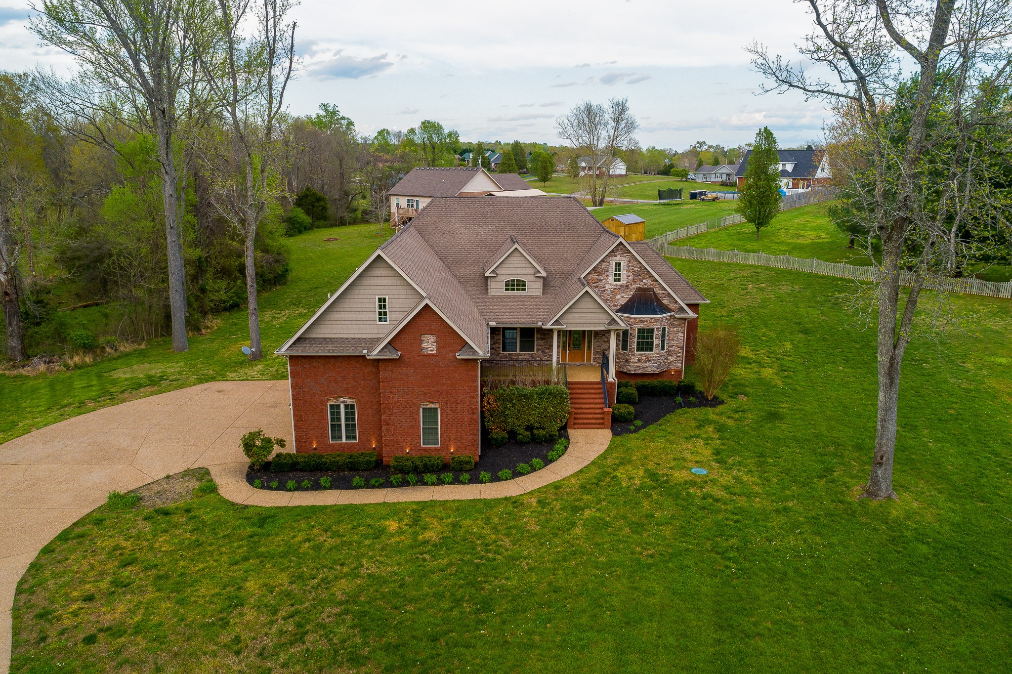 705 Deer Ridge Lane Lebanon, TN 37087 - Photo 49 of 49 a aerial view of a house next to a big yard and large trees