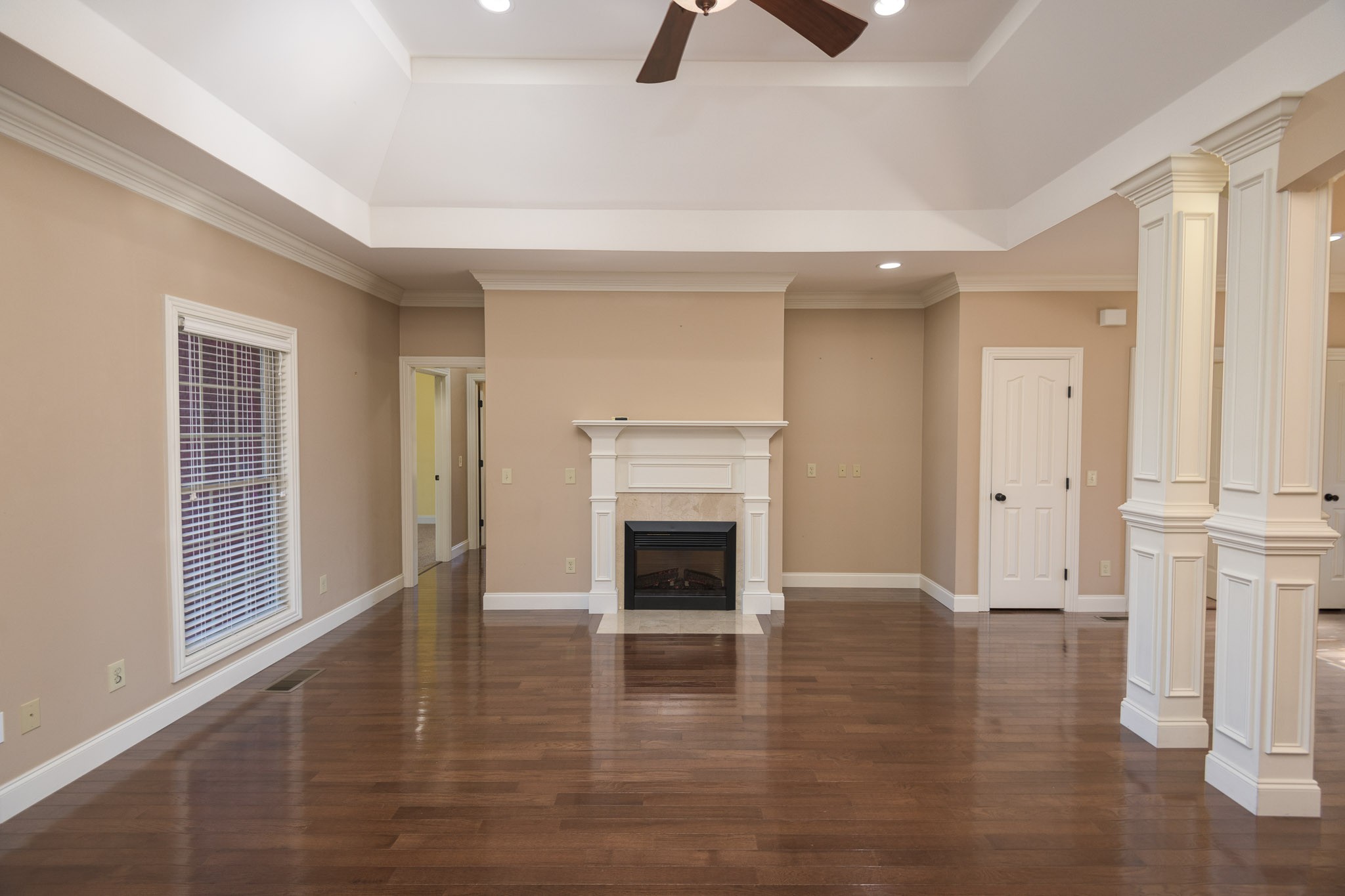 705 Deer Ridge Lane Lebanon, TN 37087 - Photo 10 of 49 a view of a livingroom with wooden floor and a ceiling fan