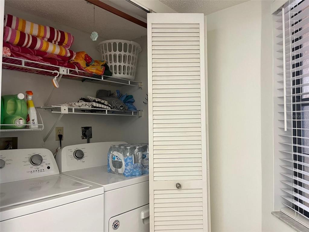 23465 Harbor View Road, Unit 1006 Punta Gorda, FL 33980 - Photo 16 of 41 a utility room with dryer and washer