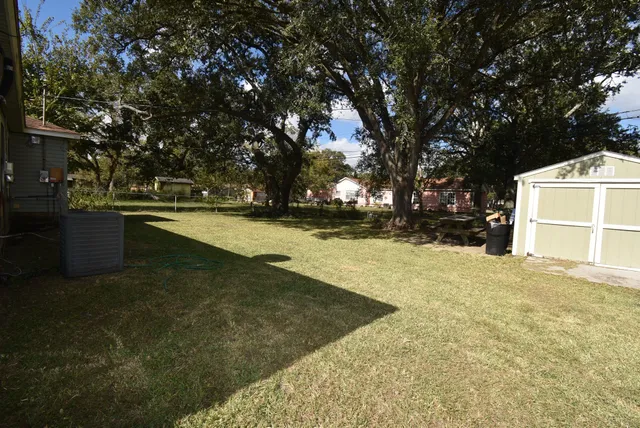 a backyard of a house with lots of green space