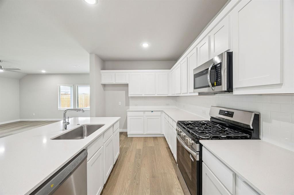 906 Windy Vly Road Princeton, TX 75407 - Photo 6 of 27 Kitchen in the Hayden home plan by Trophy Signature Homes – REPRESENTATIVE PHOTO