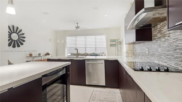 a kitchen with a sink and a stove
