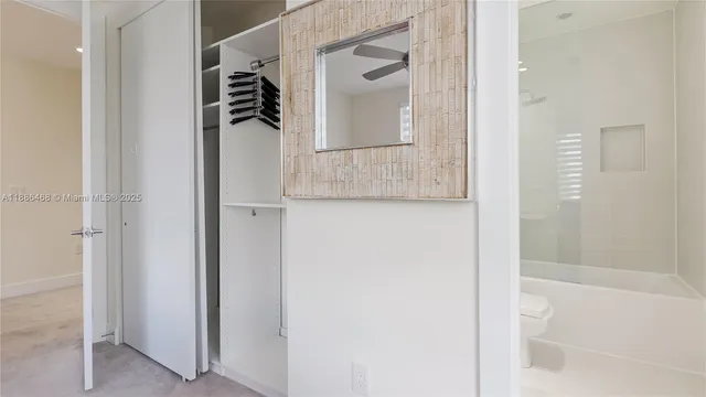 a bathroom with a shower and a mirror