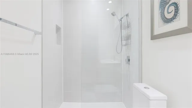 a bathroom with a shower and vanity