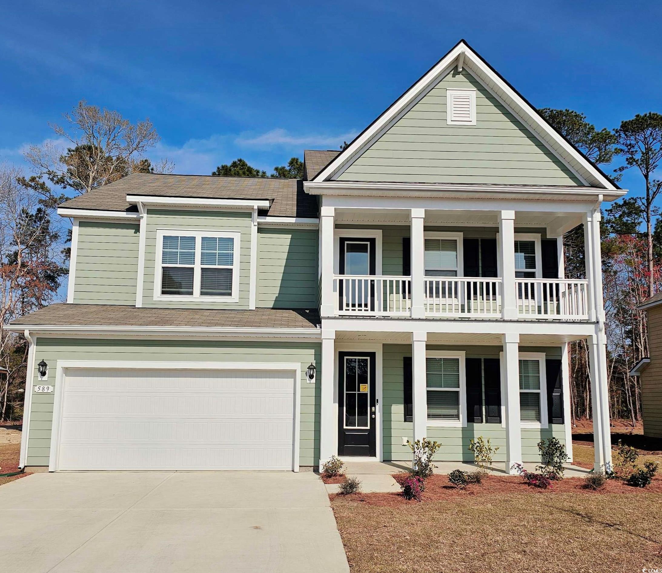 589 Haven View Way Murrells Inlet, SC 29576 - Photo 1 of 24 View of front of home with a balcony, driveway, ro