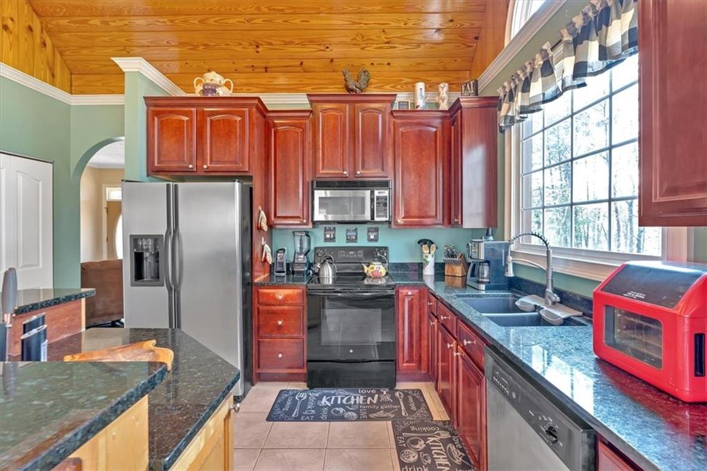 1430 Jasper Court Ranger, GA 30734 - Photo 12 of 49 a kitchen with stainless steel appliances granite countertop a sink stove and refrigerator