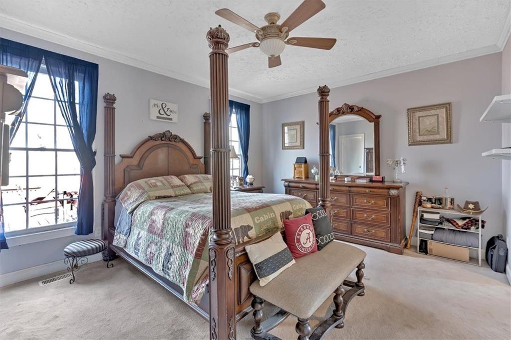1430 Jasper Court Ranger, GA 30734 - Photo 23 of 49 a bedroom with a bed couch and a window