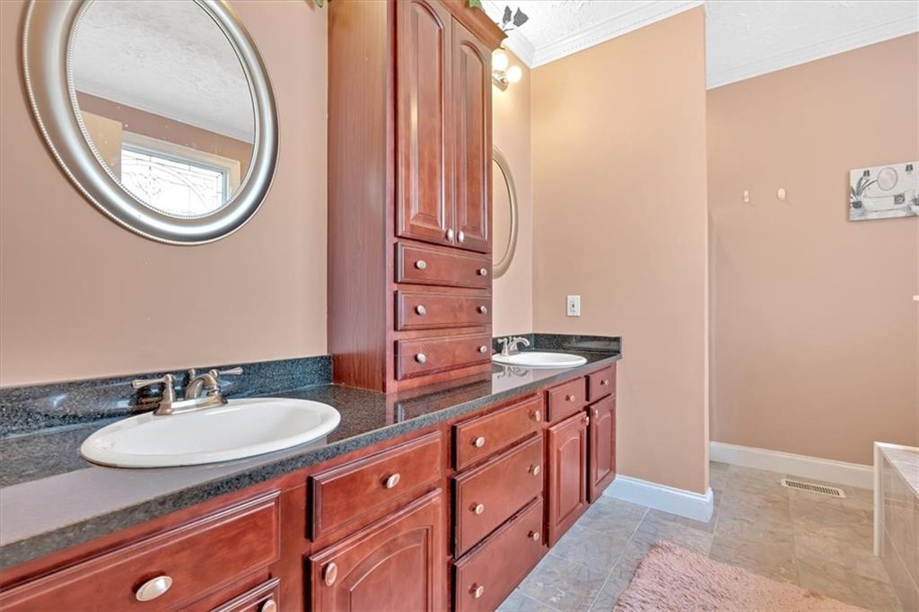 1430 Jasper Court Ranger, GA 30734 - Photo 28 of 49 a bathroom with a sink and a mirror