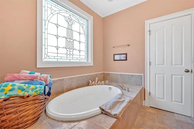 a bathroom with a tub and sink