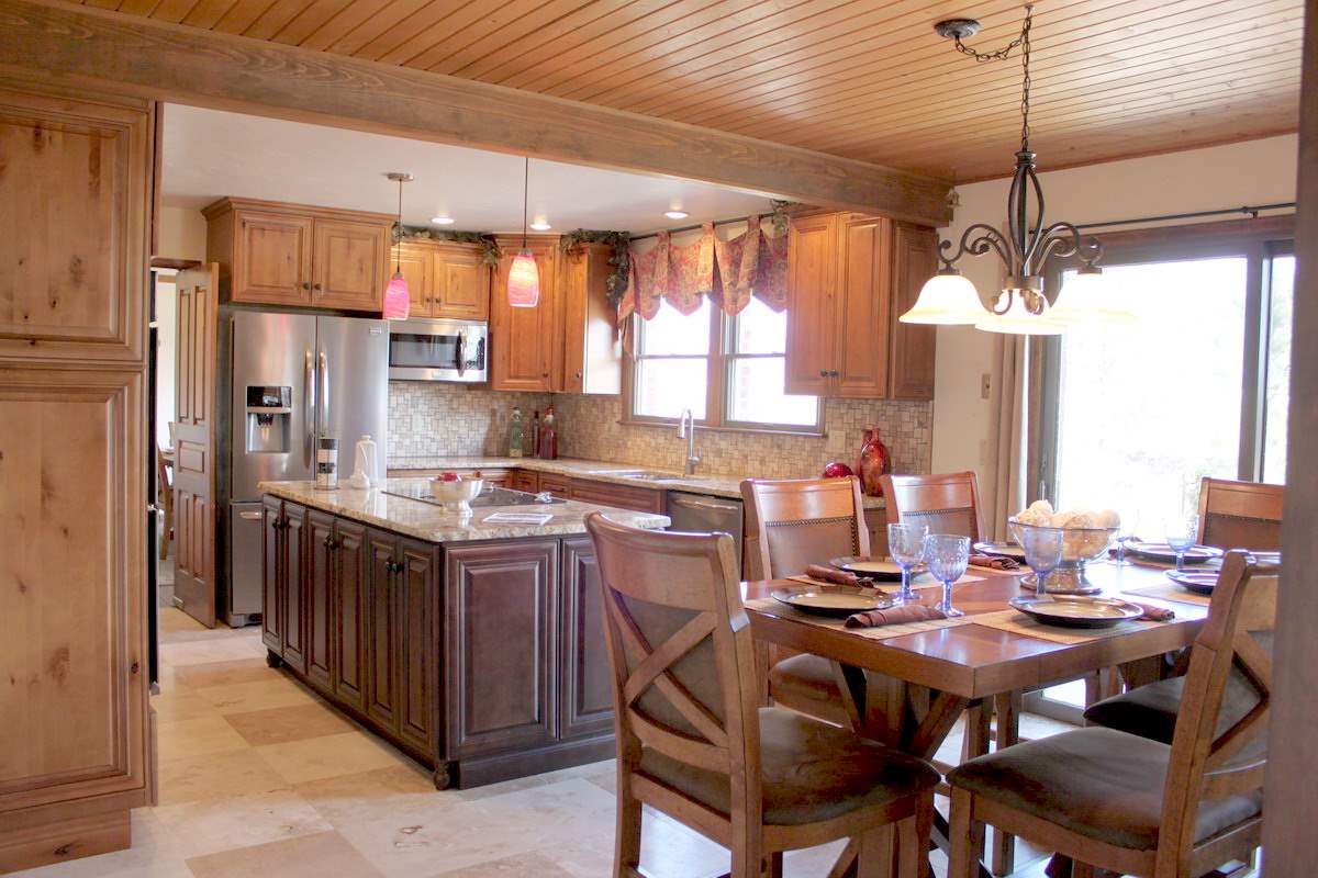 824 26 Road Grand Junction, CO 81506 - Photo 8 of 40 a kitchen with a table chairs stove and refrigerator