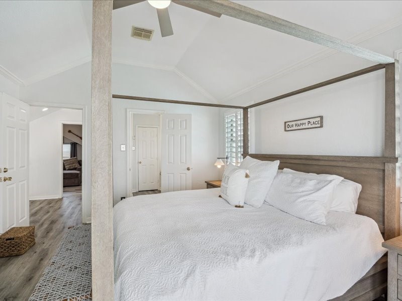 530 Dolphin Street Freeport, TX 77541 - Photo 14 of 29 a bedroom with a bed and a large mirror