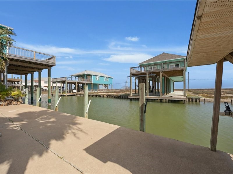 530 Dolphin Street Freeport, TX 77541 - Photo 2 of 29 a view of a lake with a building in the background