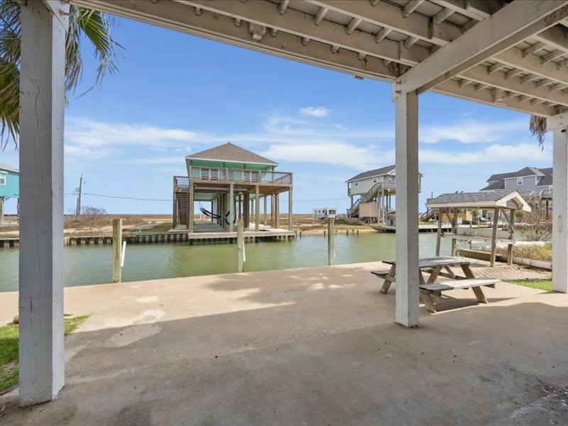 530 Dolphin Street Freeport, TX 77541 - Photo 3 of 29 a view of a lake with a house
