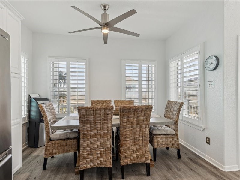 530 Dolphin Street Freeport, TX 77541 - Photo 7 of 29 a view of a dining room with furniture window and wooden floor