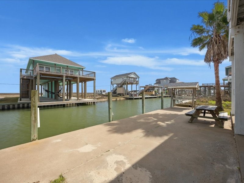 530 Dolphin Street Freeport, TX 77541 - Photo 9 of 29 a view of a lake with a house