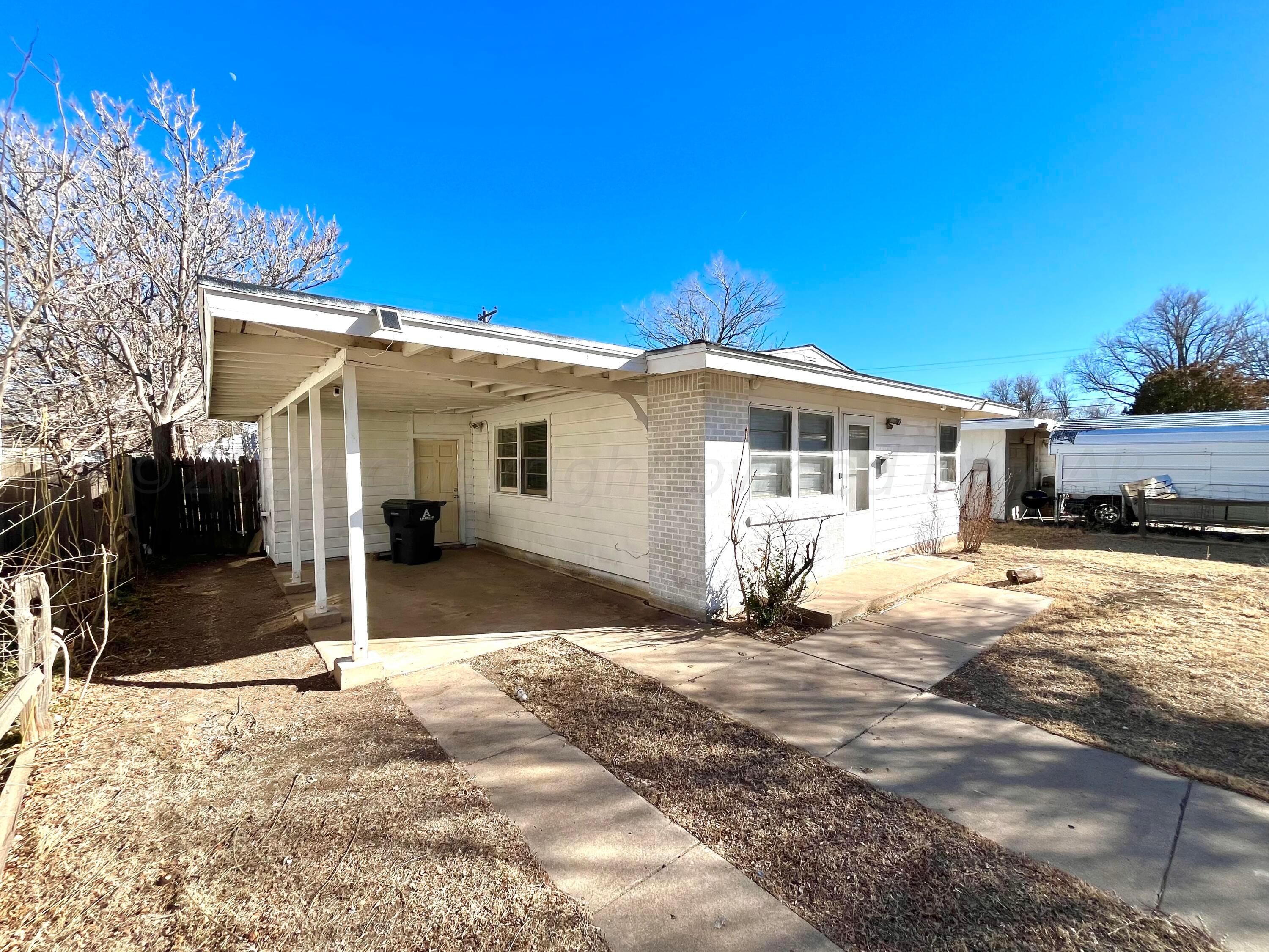 4017 Gables Street Amarillo, TX 79110 - Photo 4 of 13 a view of a house with a patio