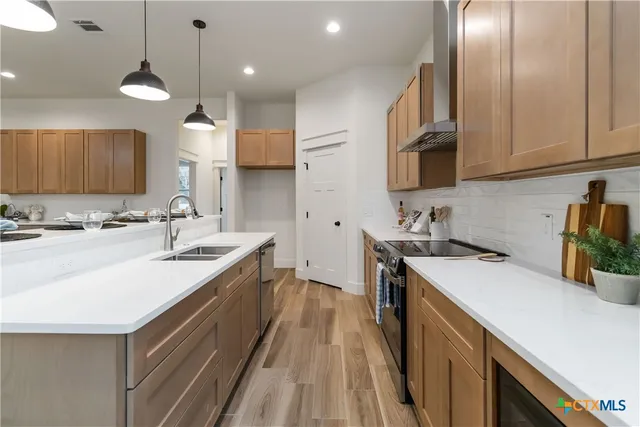 a bathroom with a potted plant on the counter
