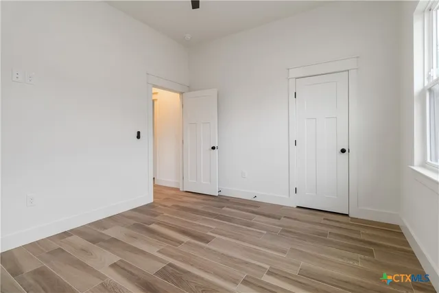 a outdoor dining space with furniture and window