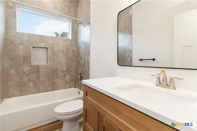 an aerial view of a house with a garden