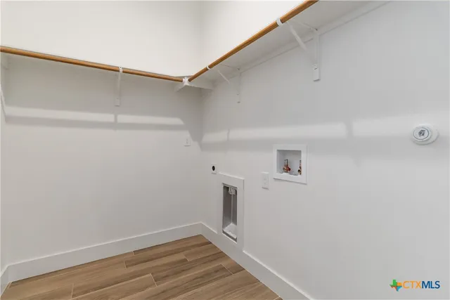 an aerial view of a house with a yard and garden