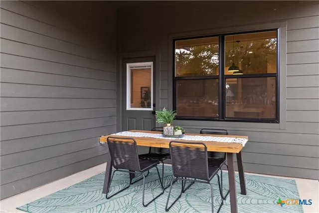 an aerial view of house with yard