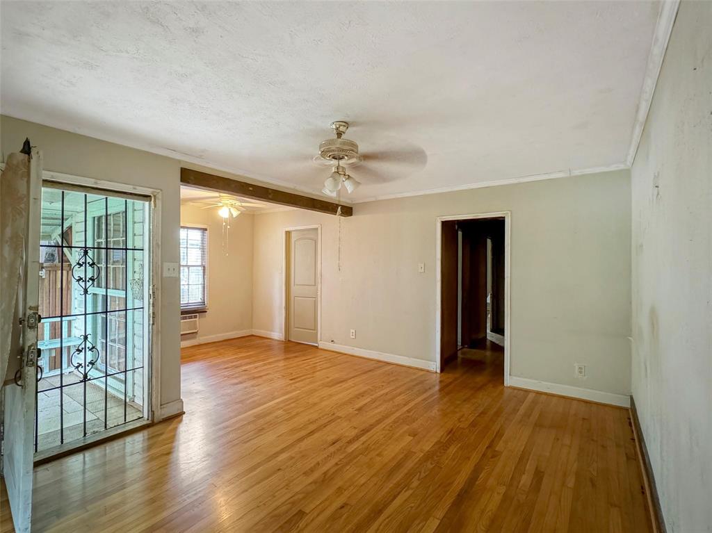 5532 Junius Street Dallas, TX 75214 - Photo 4 of 9 wooden floor in an empty room with a window