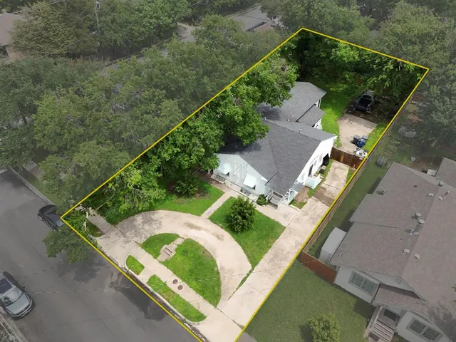 an aerial view of house with a yard