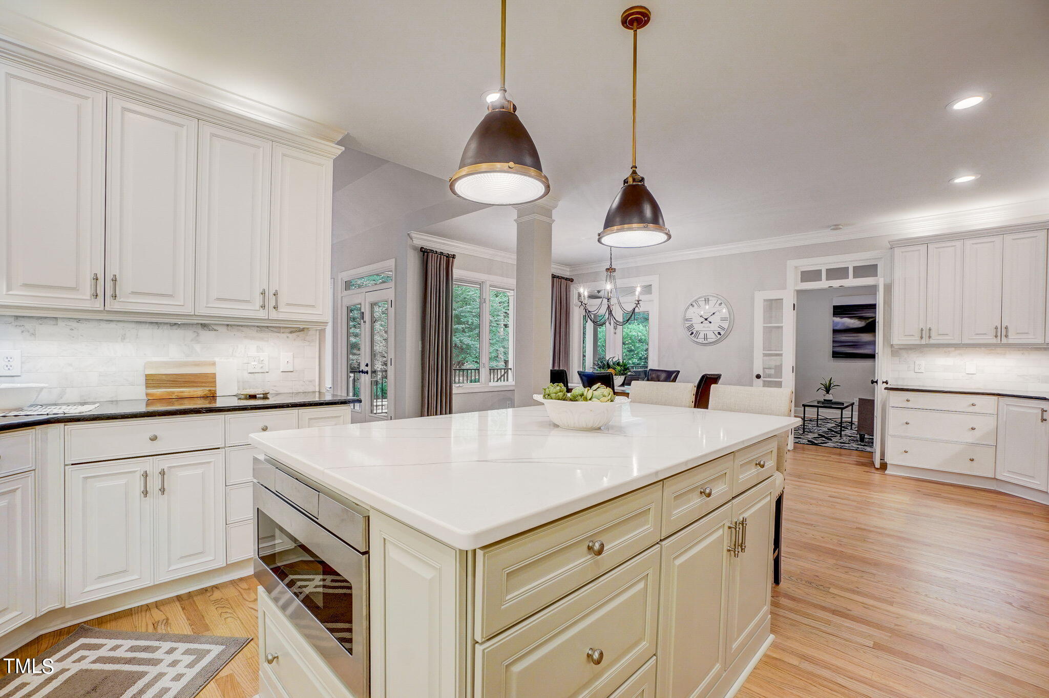 5101 Roseland Court Raleigh, NC 27613 - Photo 12 of 71 a kitchen with stainless steel appliances granite countertop a sink a stove and a wooden floors