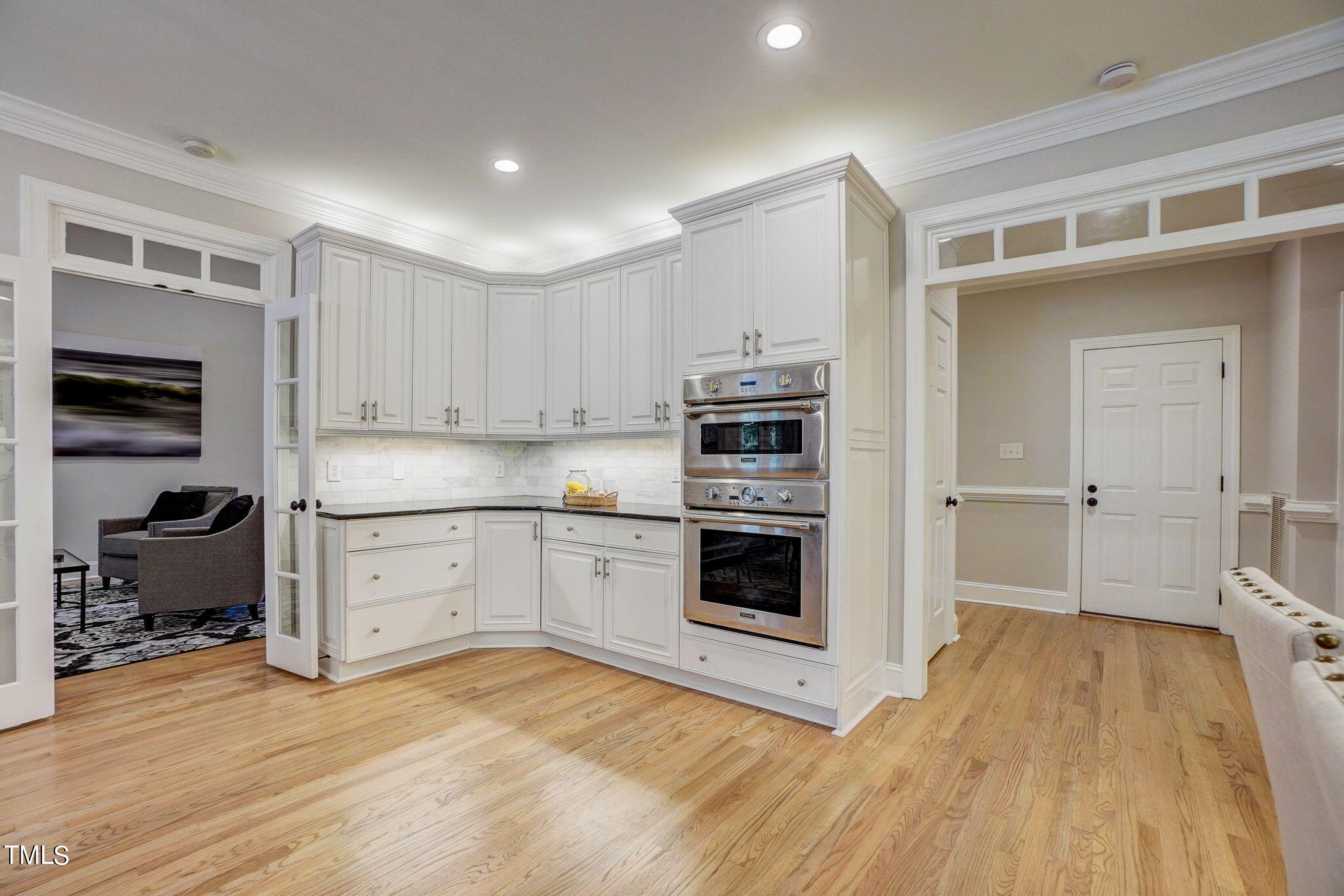 5101 Roseland Court Raleigh, NC 27613 - Photo 13 of 71 a kitchen with stainless steel appliances granite countertop a stove and a refrigerator