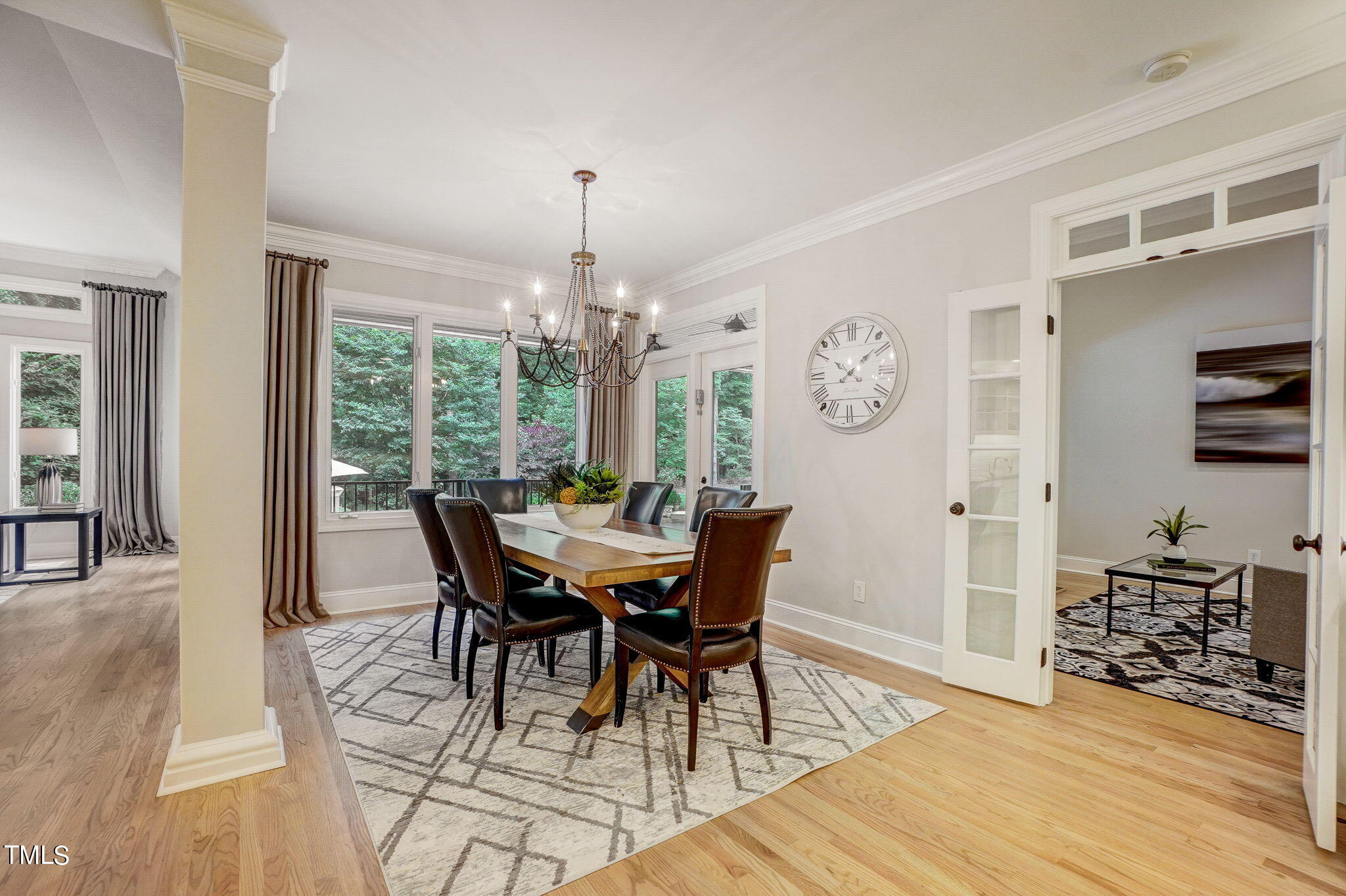 5101 Roseland Court Raleigh, NC 27613 - Photo 19 of 71 a view of a dining room with furniture window and wooden floor