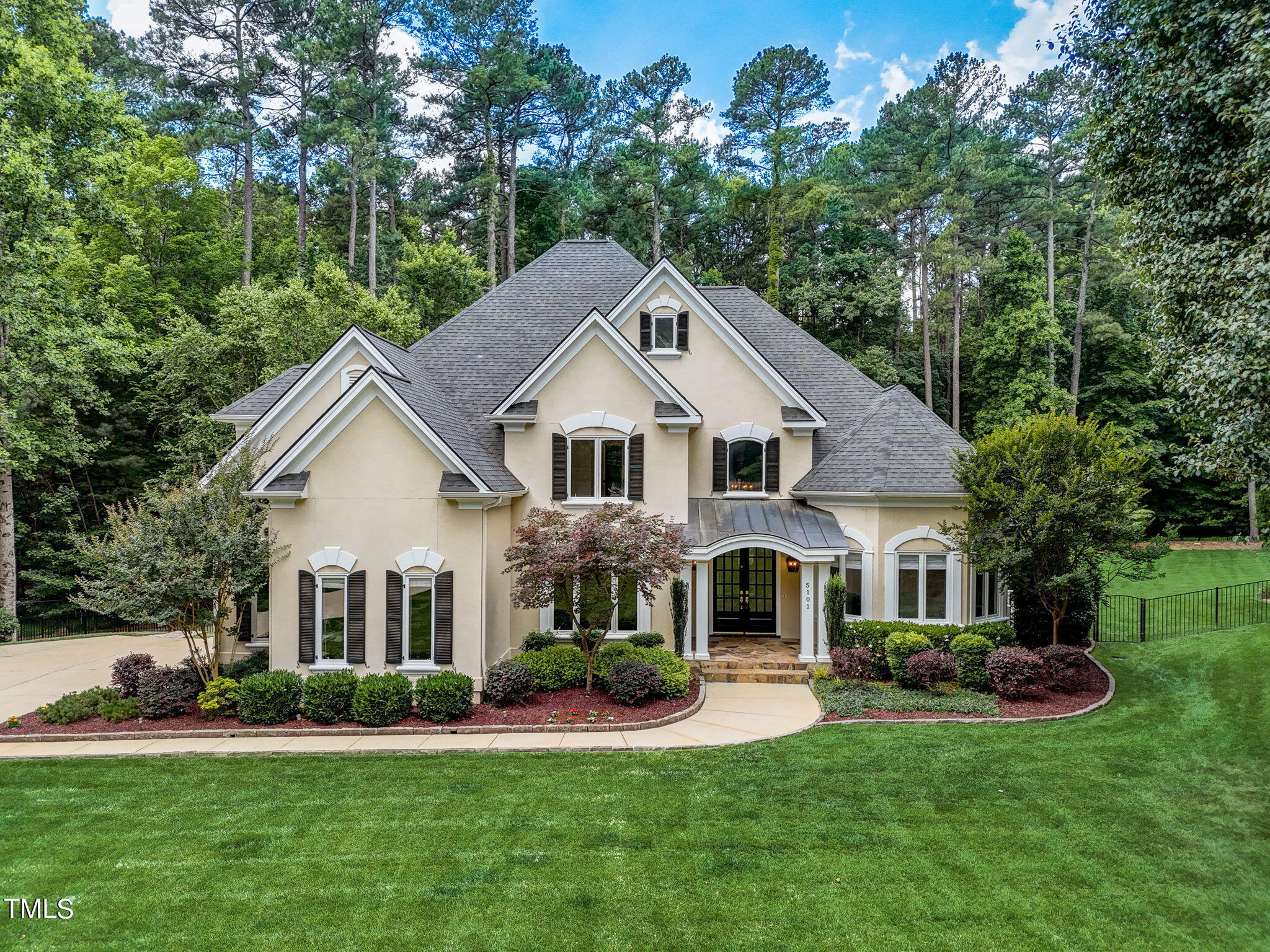 5101 Roseland Court Raleigh, NC 27613 - Photo 2 of 71 a front view of a house with a yard