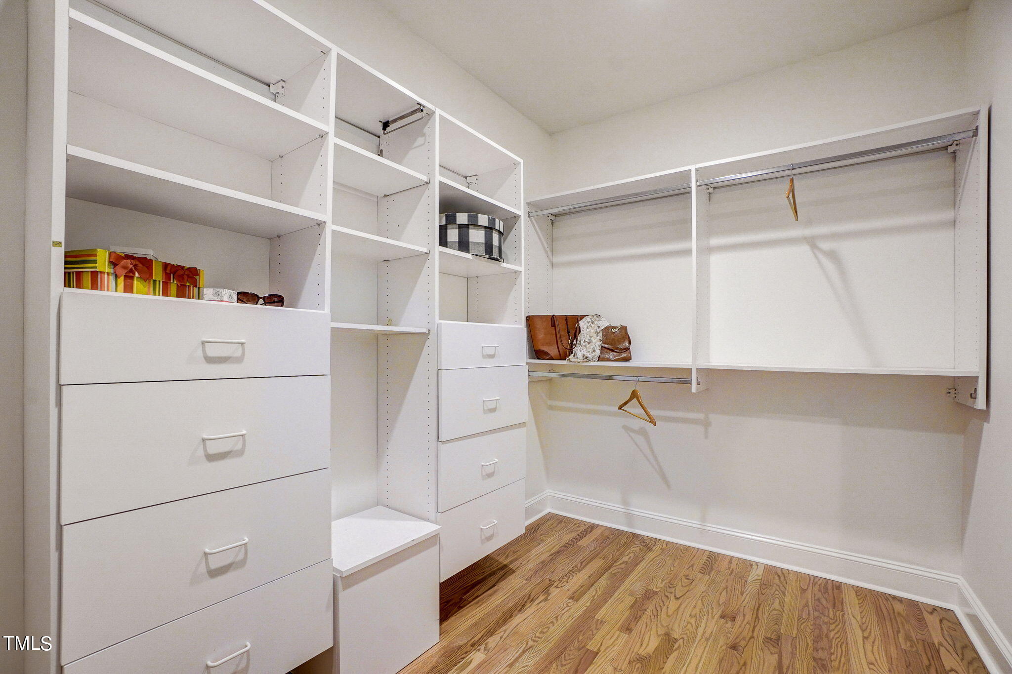 5101 Roseland Court Raleigh, NC 27613 - Photo 24 of 71 a view of walk in closet with empty racks