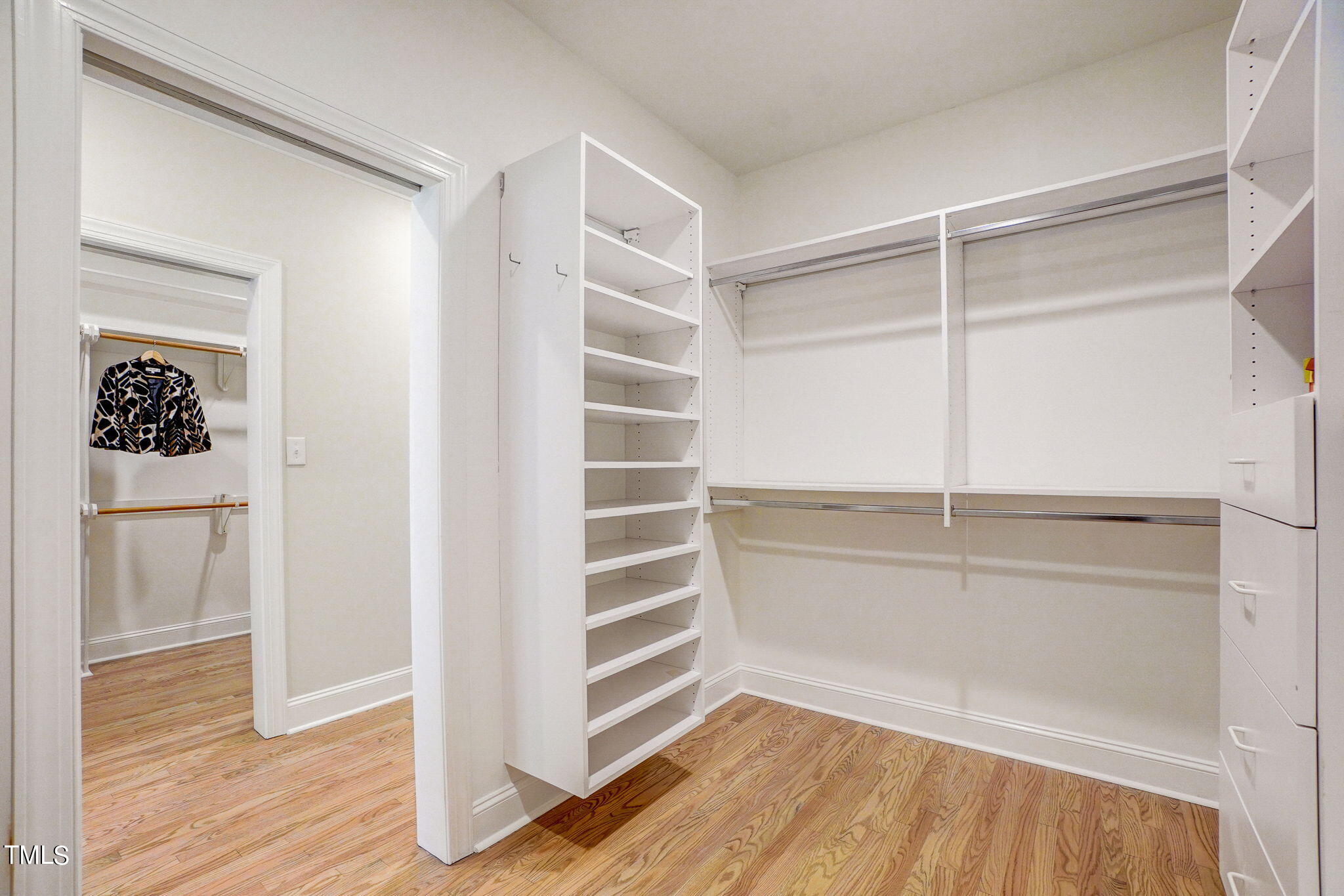 5101 Roseland Court Raleigh, NC 27613 - Photo 25 of 71 a view of walk in closet with empty racks