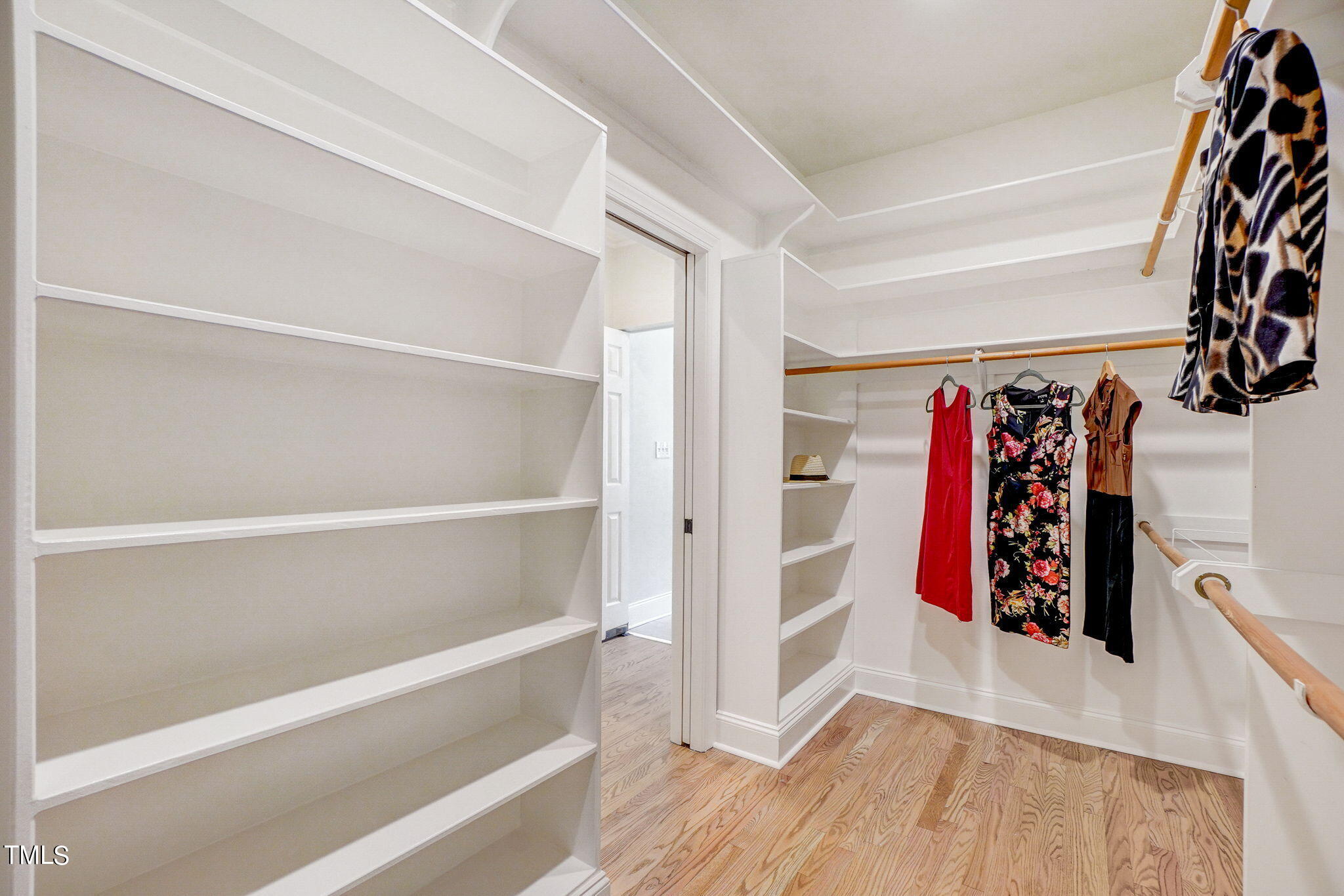 5101 Roseland Court Raleigh, NC 27613 - Photo 26 of 71 a view of walk in closet with clothes and shoes