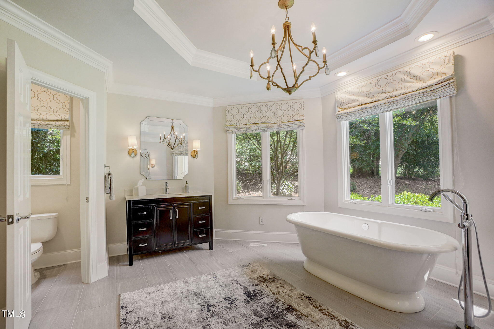 5101 Roseland Court Raleigh, NC 27613 - Photo 27 of 71 a living room with furniture and a large window