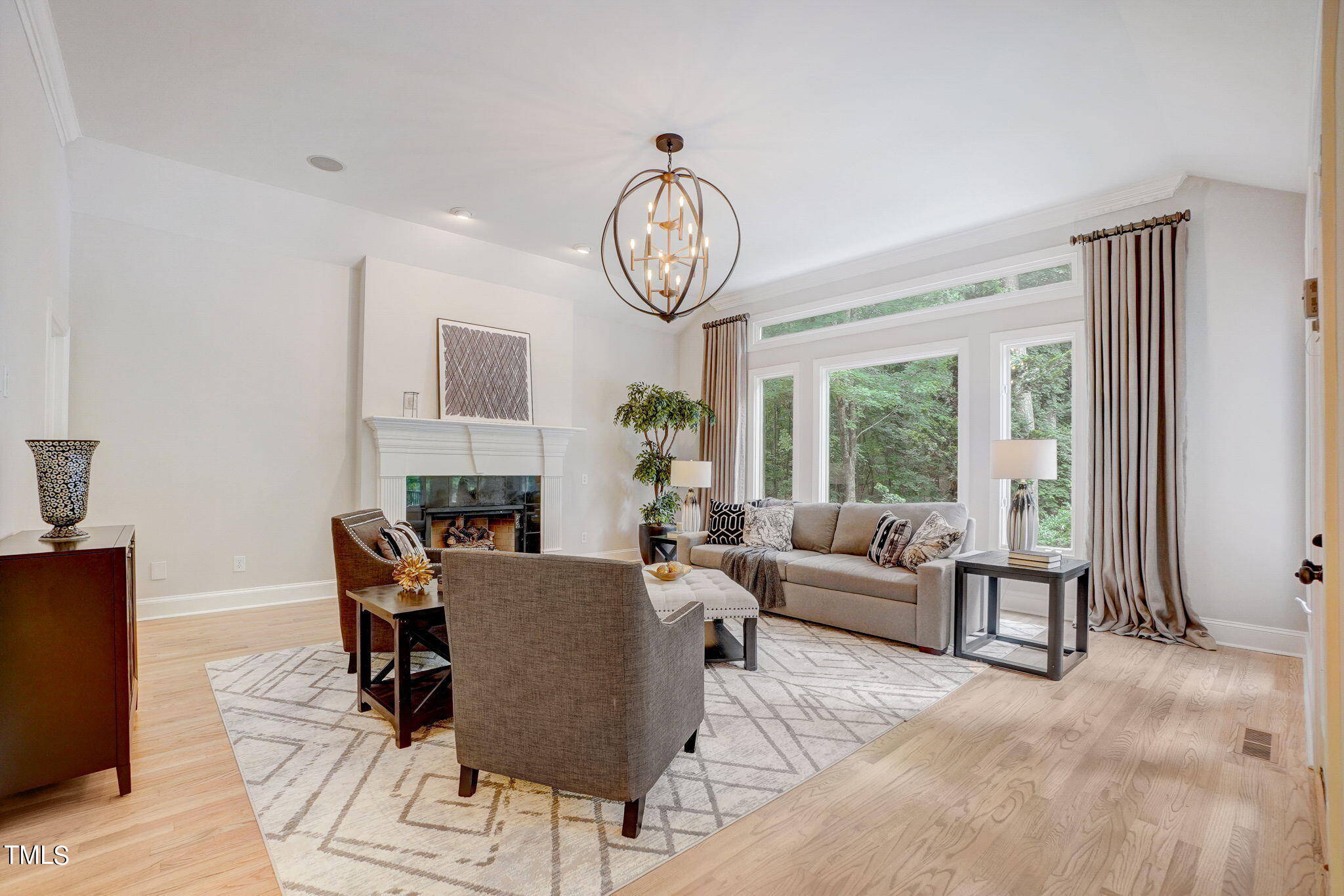 5101 Roseland Court Raleigh, NC 27613 - Photo 32 of 71 a living room with fireplace furniture and a large window